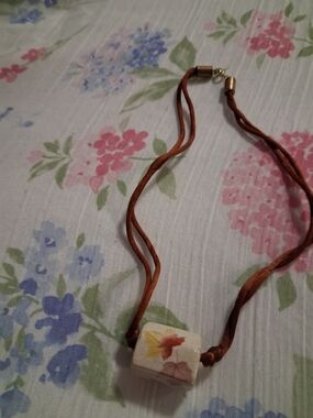 Brown Leather Cord Necklace with Floral Ceramic Bead